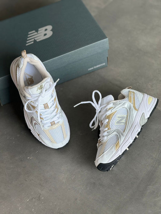 NEW BALANCE 530 BLANCO - DORADO
