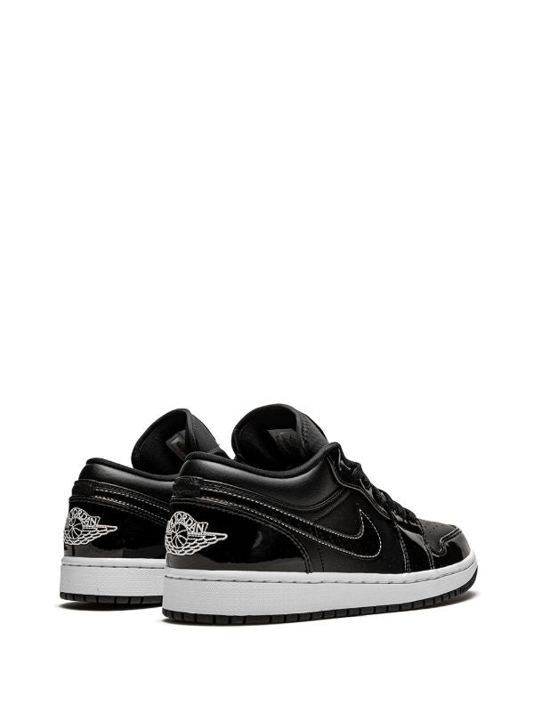 JORDAN RETRO 1 LOW CHAROL NEGRO / BLANCO